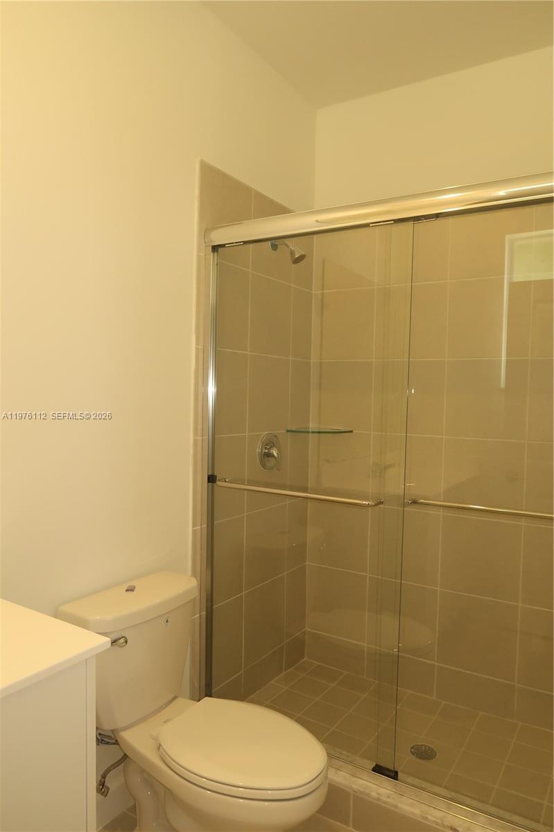 1509 Southeast 27th Street Homestead, FL 33035 - Photo 12 of 27 a bathroom with a toilet and shower