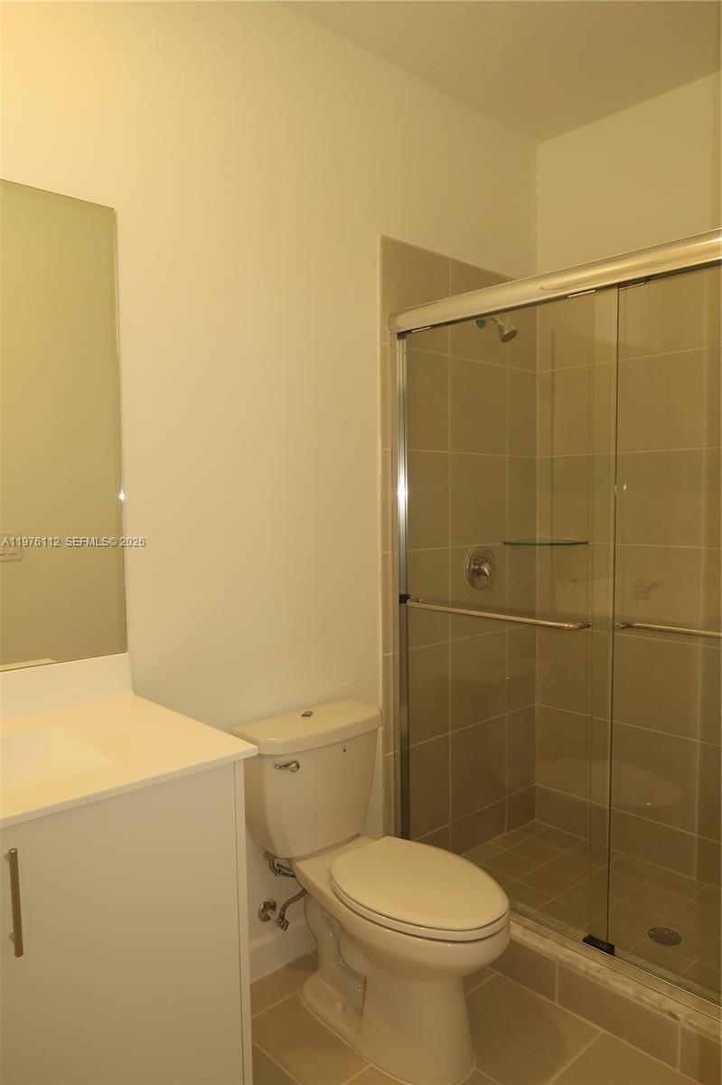 1509 Southeast 27th Street Homestead, FL 33035 - Photo 13 of 27 a bathroom with a toilet and a shower