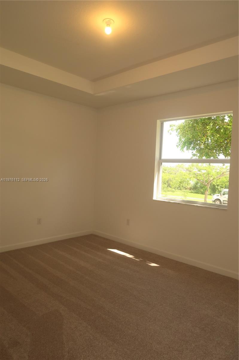 1509 Southeast 27th Street Homestead, FL 33035 - Photo 14 of 27 an empty room with a window