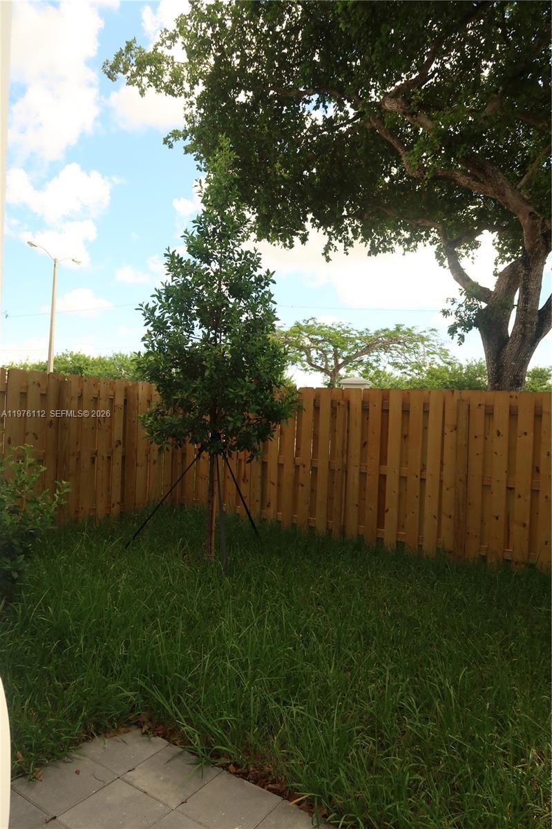 1509 Southeast 27th Street Homestead, FL 33035 - Photo 25 of 27 a backyard of a house with lots of green space