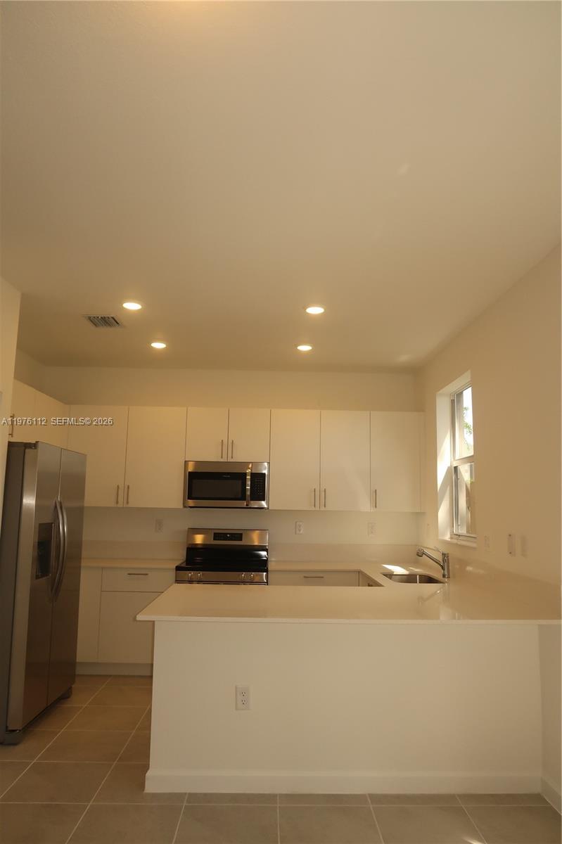 1509 Southeast 27th Street Homestead, FL 33035 - Photo 26 of 27 a view of counter top space and stainless steel appliances