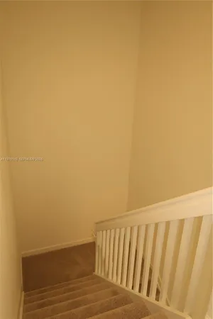a view of balcony with wooden floor
