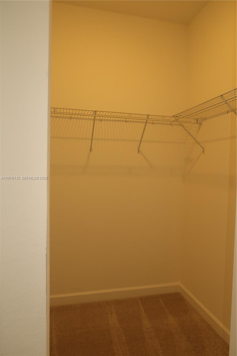 1509 Southeast 27th Street Homestead, FL 33035 - Photo 10 of 27 a view of a room with racks on the wall