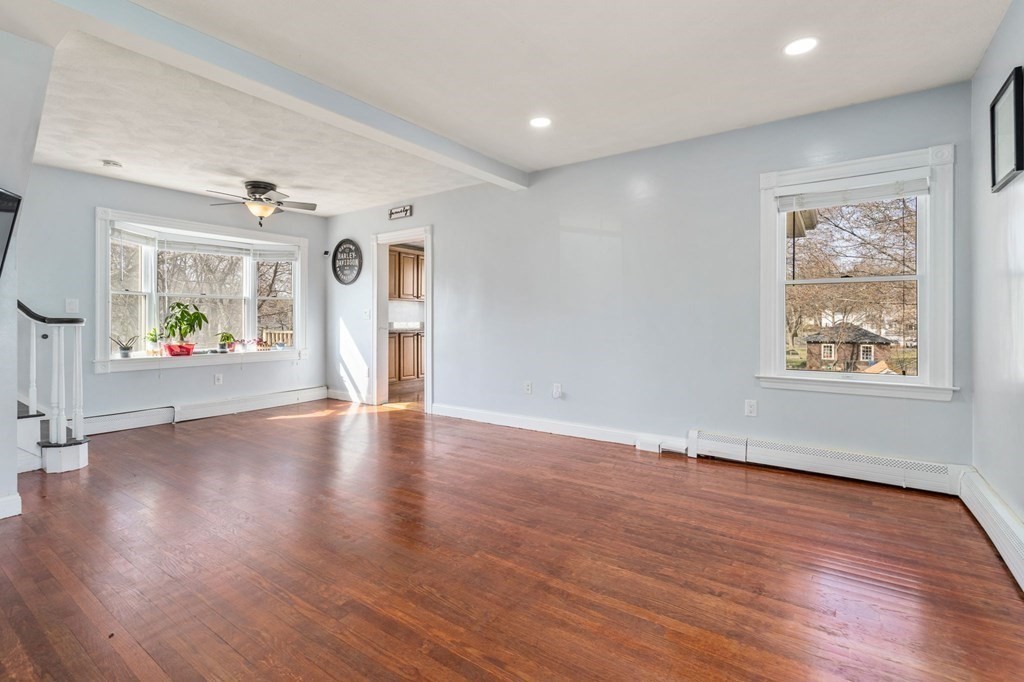 83 Cedar Street Wakefield, MA 01880 - Photo 14 of 36 an empty room with window and wooden floor