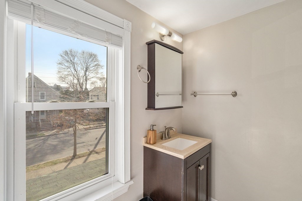 83 Cedar Street Wakefield, MA 01880 - Photo 17 of 36 a bathroom with a sink mirror and a shower