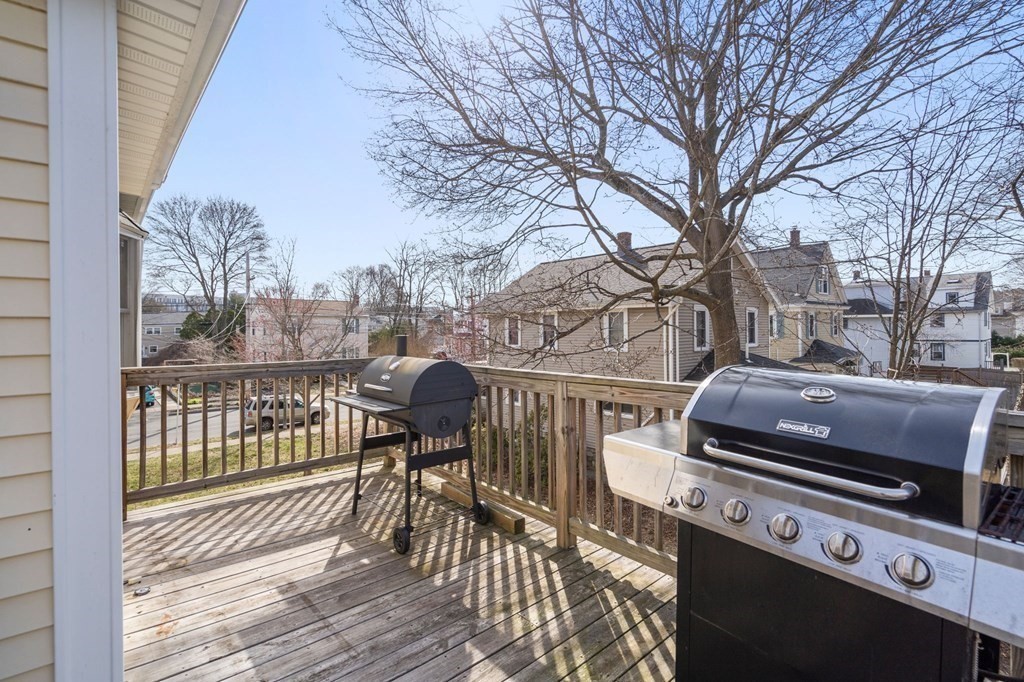 83 Cedar Street Wakefield, MA 01880 - Photo 20 of 36 a view of a chairs and table on the deck