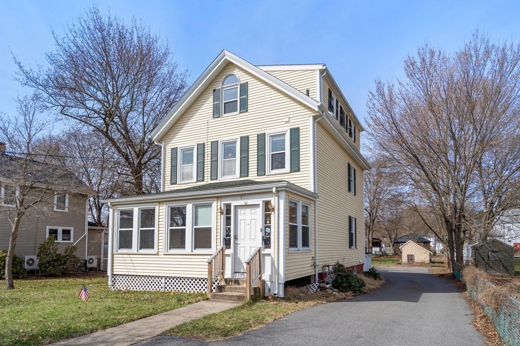 83 Cedar Street Wakefield, MA 01880 - Photo 2 of 36 a front view of a house with a yard