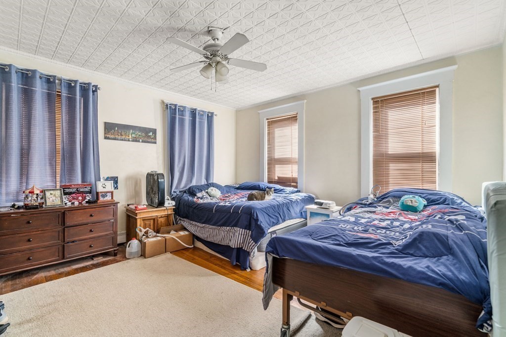83 Cedar Street Wakefield, MA 01880 - Photo 25 of 36 a bedroom with bed and window