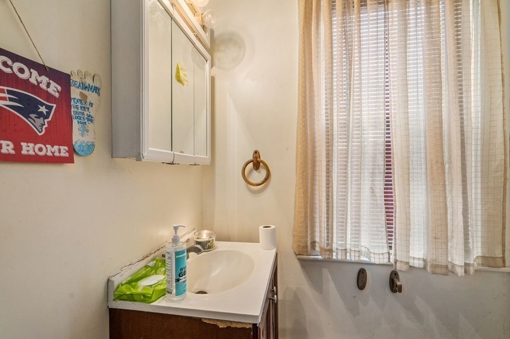 83 Cedar Street Wakefield, MA 01880 - Photo 26 of 36 a bathroom with a sink and a mirror