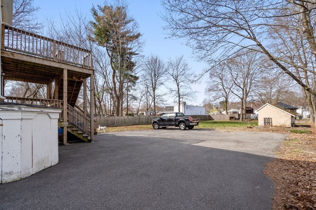 83 Cedar Street Wakefield, MA 01880 - Photo 28 of 36 a view of a house with a snow in the yard