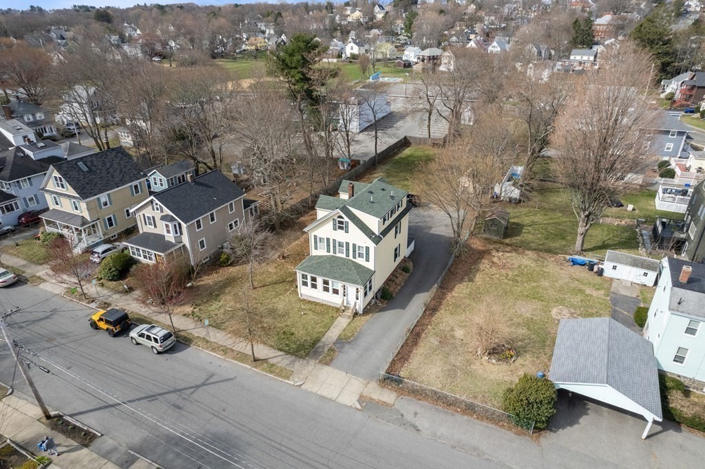 83 Cedar Street Wakefield, MA 01880 - Photo 32 of 36 an aerial view of a house with outdoor space