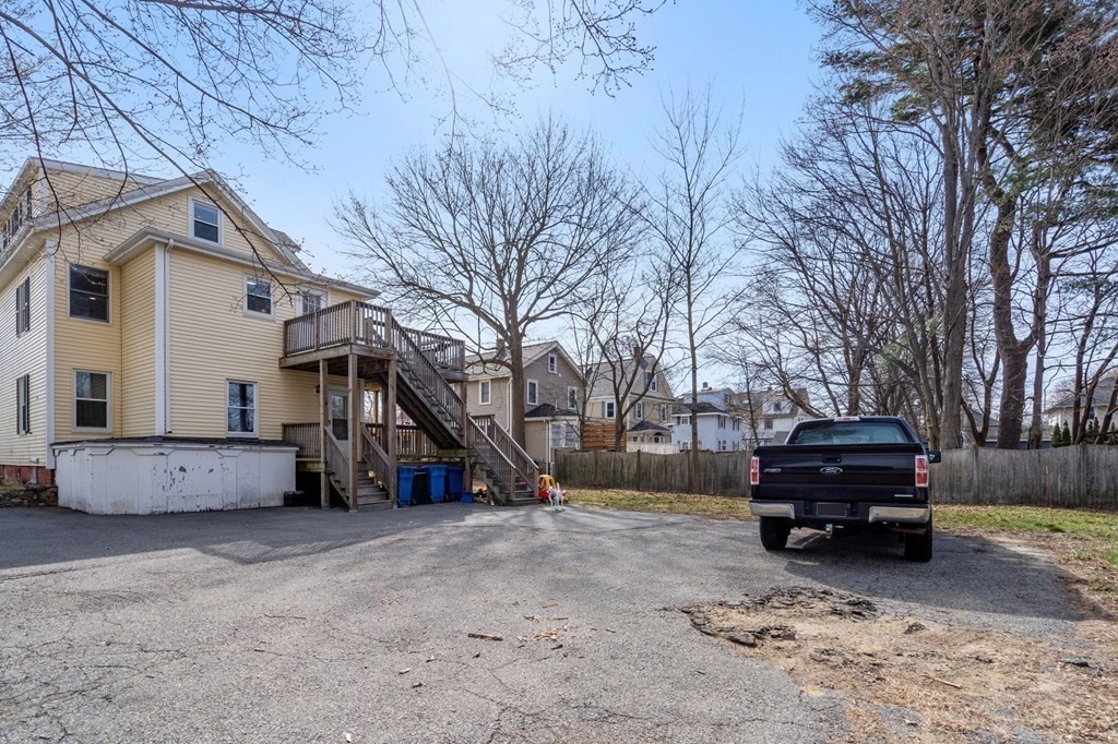 83 Cedar Street Wakefield, MA 01880 - Photo 33 of 36 a car parked in front of a house
