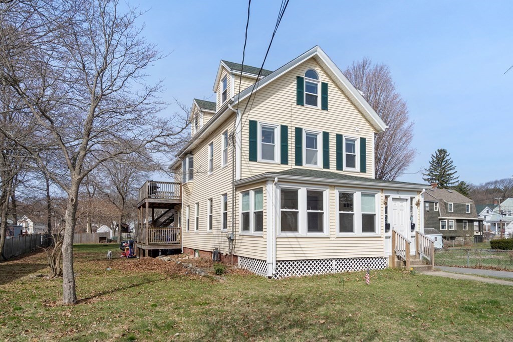 83 Cedar Street Wakefield, MA 01880 - Photo 35 of 36 a front view of a house with a yard