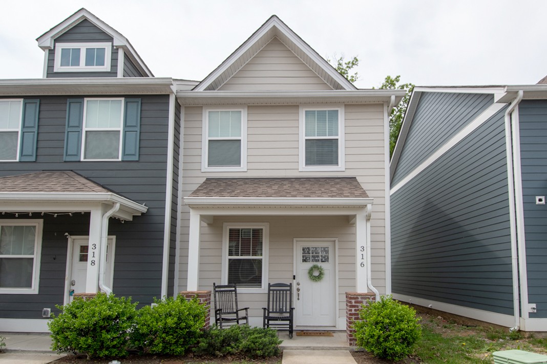 1382 Rural Hill Road, Unit 316 Antioch, TN 37013 - Photo 1 of 23 a front view of a house with plants