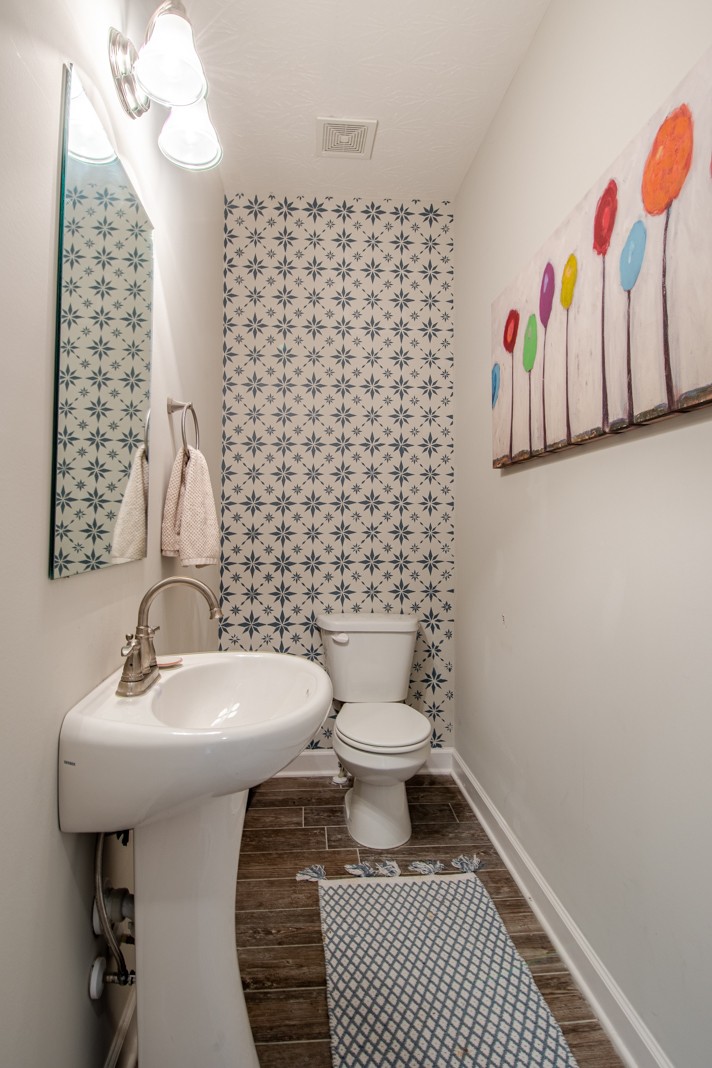 1382 Rural Hill Road, Unit 316 Antioch, TN 37013 - Photo 19 of 23 a bathroom with a sink a toilet and shower curtain