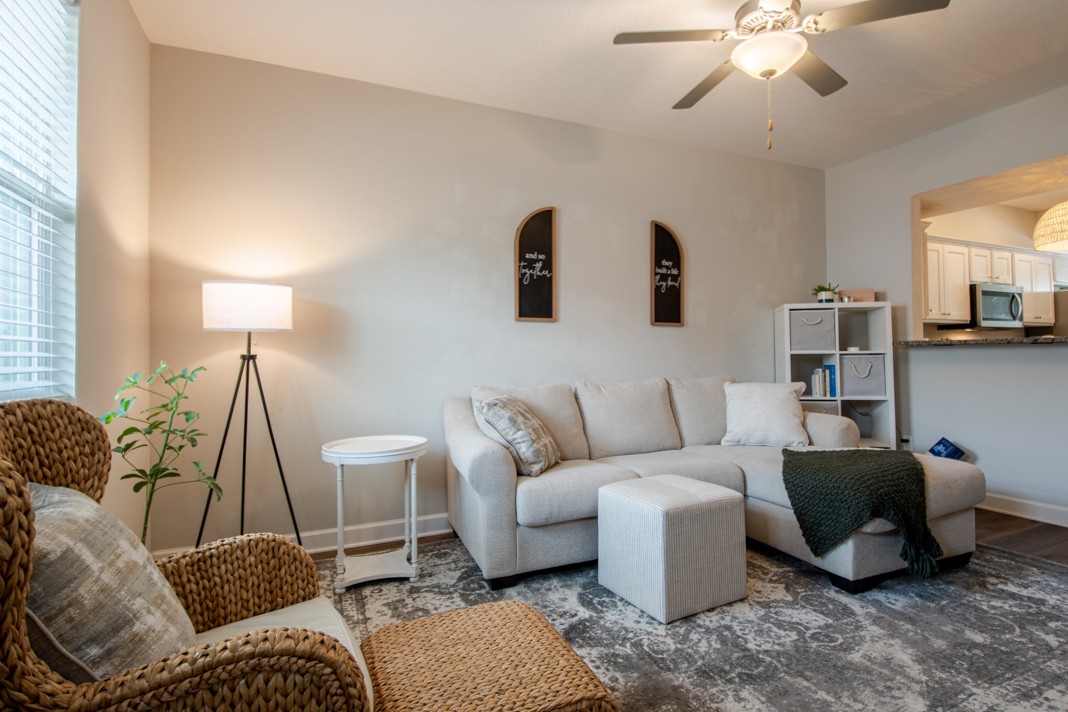 1382 Rural Hill Road, Unit 316 Antioch, TN 37013 - Photo 5 of 23 a living room with furniture a bed and a chandelier