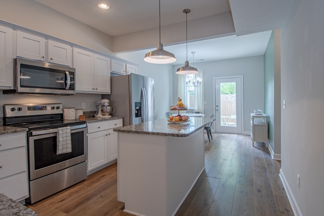 1382 Rural Hill Road, Unit 316 Antioch, TN 37013 - Photo 8 of 23 a kitchen with stainless steel appliances a stove a sink and a refrigerator