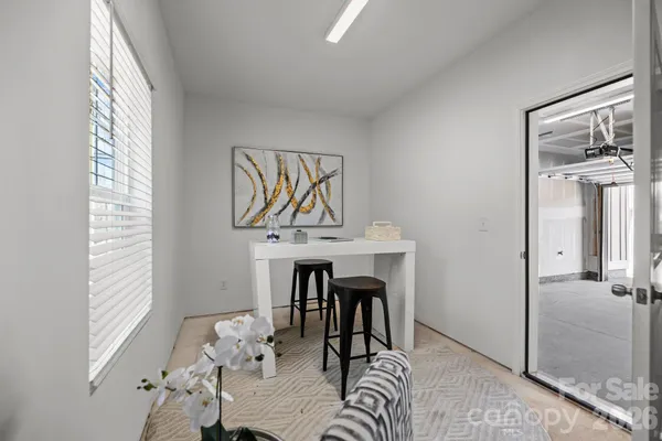 a view of a livingroom with furniture window and wooden floor