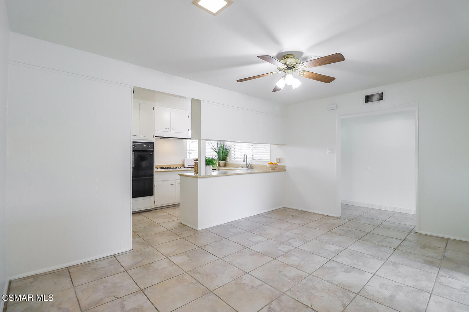1870 Burch Avenue Simi Valley, CA 93063 - Photo 6 of 20 a kitchen with white cabinets and window