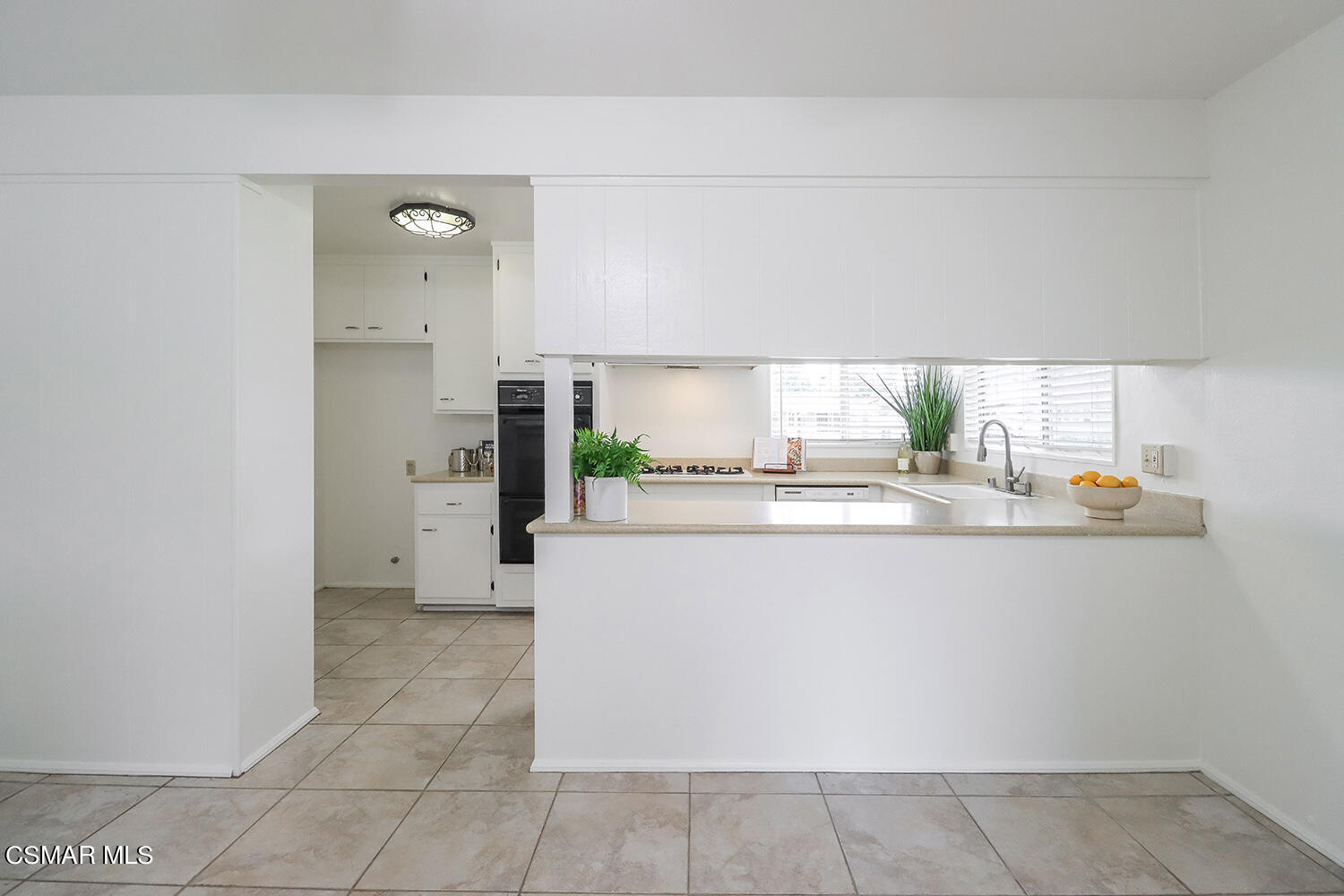 1870 Burch Avenue Simi Valley, CA 93063 - Photo 8 of 20 a kitchen with stainless steel appliances a refrigerator and a stove