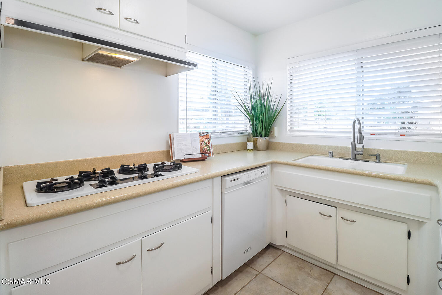 1870 Burch Avenue Simi Valley, CA 93063 - Photo 9 of 20 a kitchen with a sink a stove and cabinets