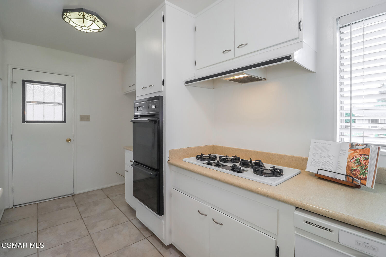 1870 Burch Avenue Simi Valley, CA 93063 - Photo 10 of 20 a kitchen with a refrigerator and a stove