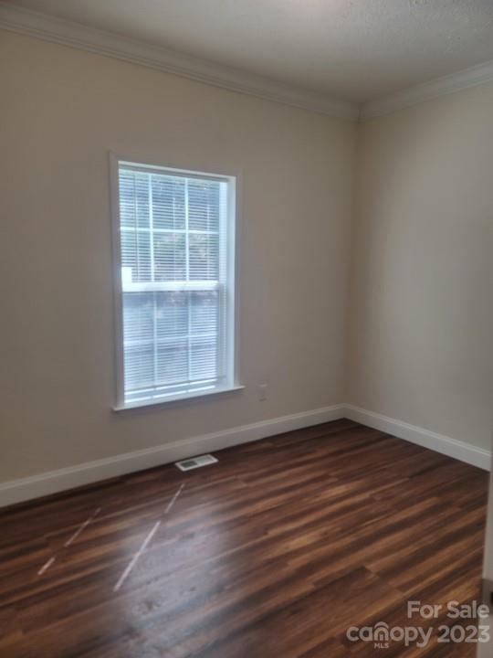 37 Hampton Heights Road Canton, NC 28716 - Photo 11 of 15 a view of an empty room with wooden floor and a window
