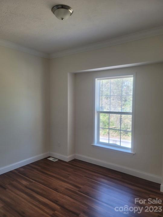 37 Hampton Heights Road Canton, NC 28716 - Photo 12 of 15 a view of an empty room with wooden floor and a window