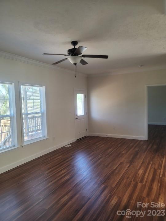 37 Hampton Heights Road Canton, NC 28716 - Photo 13 of 15 a view of an empty room with wooden floor and a window