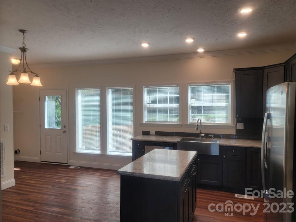 37 Hampton Heights Road Canton, NC 28716 - Photo 5 of 15 a kitchen with stainless steel appliances granite countertop a sink stove and refrigerator