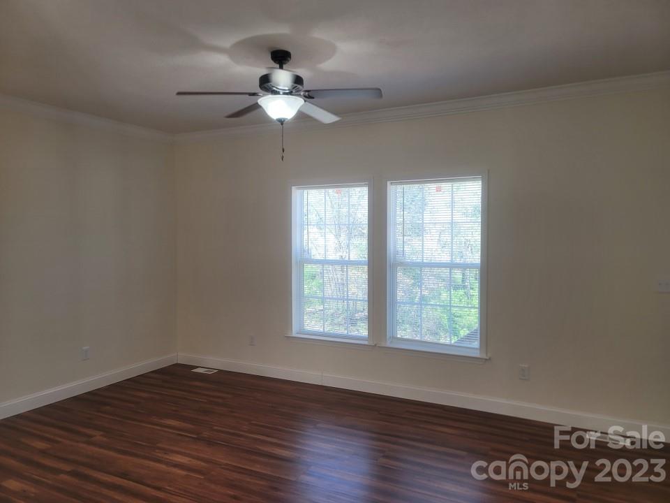 37 Hampton Heights Road Canton, NC 28716 - Photo 6 of 15 a view of an empty room with wooden floor and a window