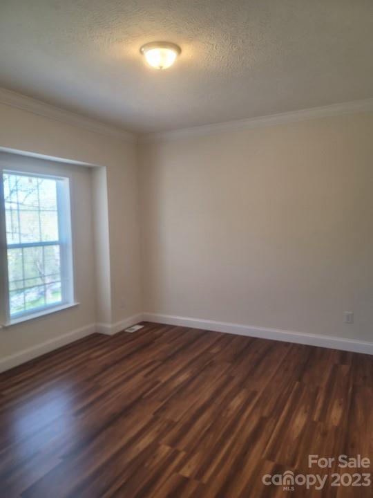 37 Hampton Heights Road Canton, NC 28716 - Photo 7 of 15 an empty room with wooden floor and windows