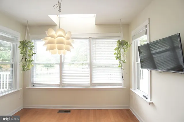 a bathroom with a large window sink and vanity