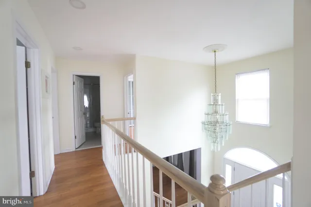 a view of an entryway with wooden floor