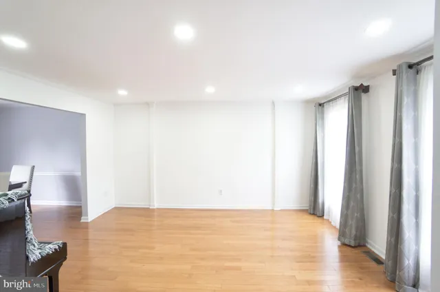 a view of empty room with a fireplace