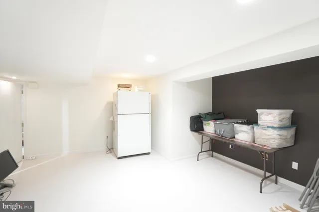 a view of a livingroom with furniture and a table