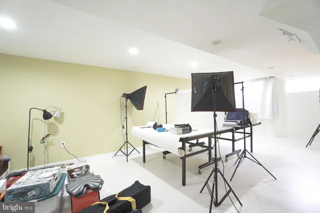 a view of a yard with wooden fence