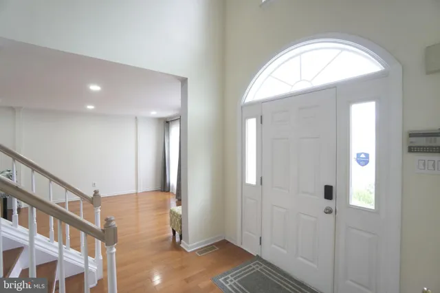 a view of livingroom with hardwood floor and hallway
