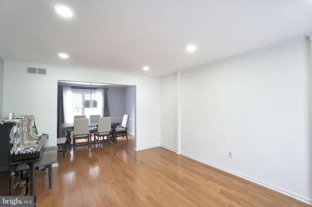 a view of dining room with furniture and wooden floor