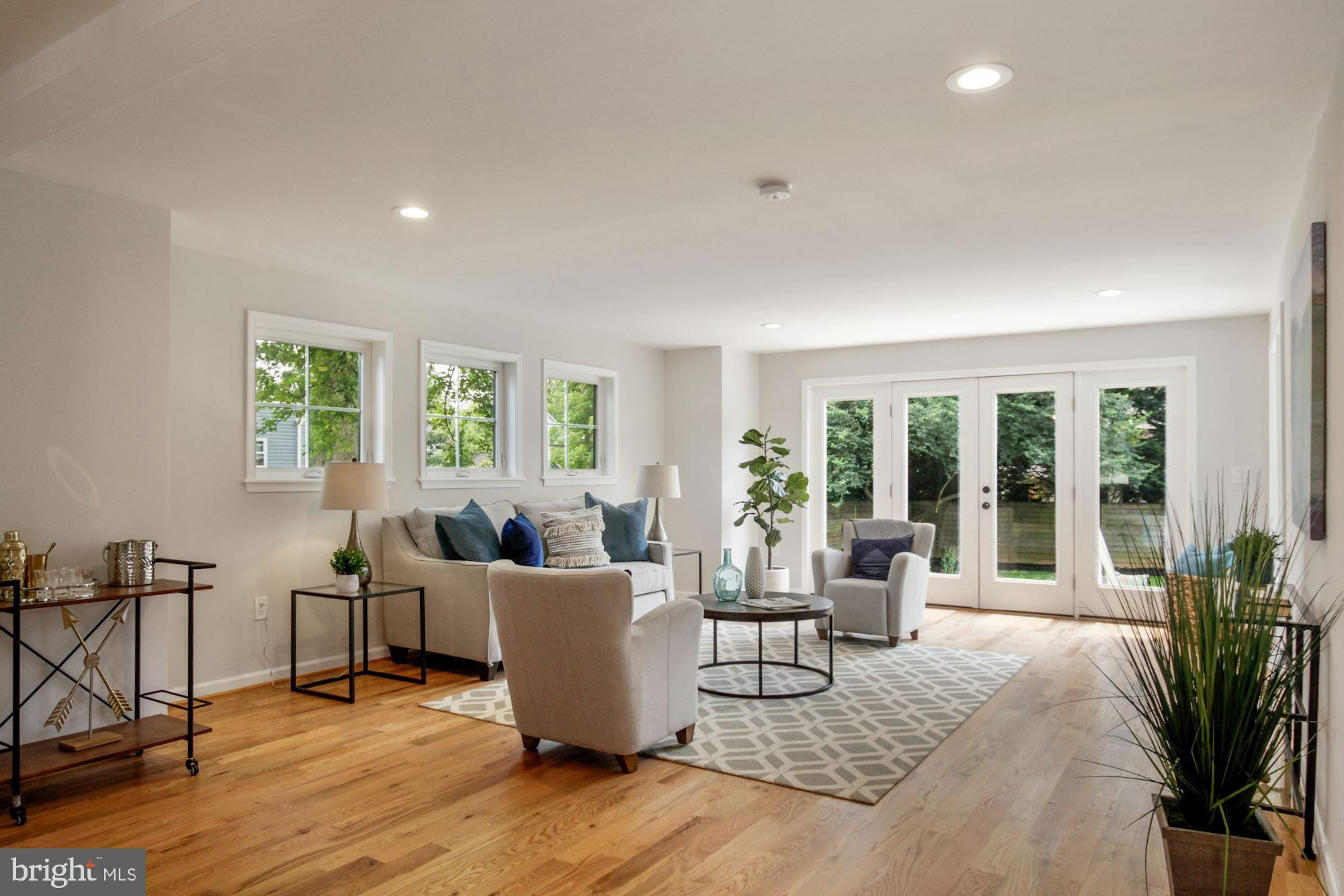 8112 Old Georgetown Road Bethesda, MD 20814 - Photo 2 of 51 a living room with furniture large window and wooden floor