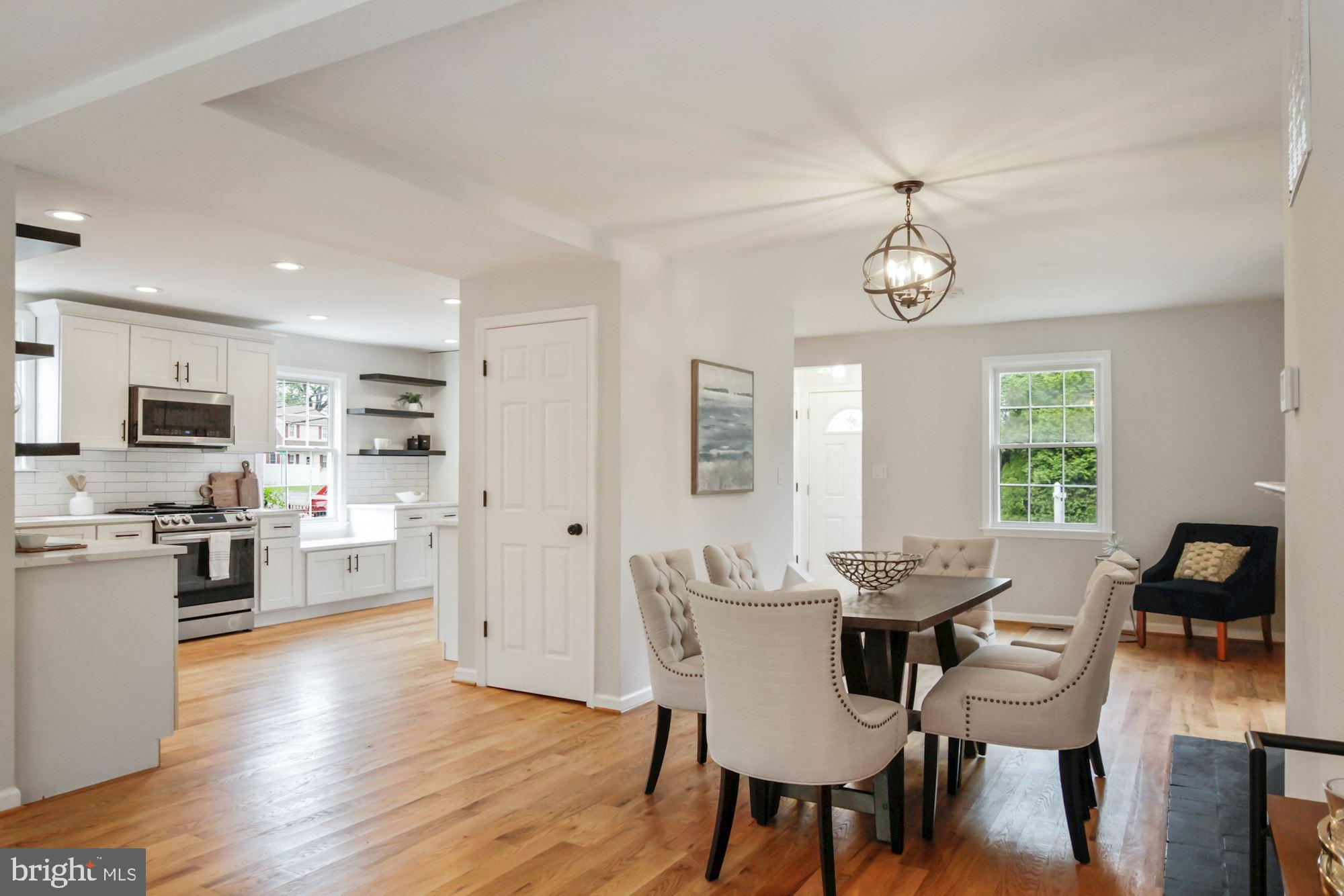 8112 Old Georgetown Road Bethesda, MD 20814 - Photo 11 of 51 a view of a dining room with furniture window and wooden floor
