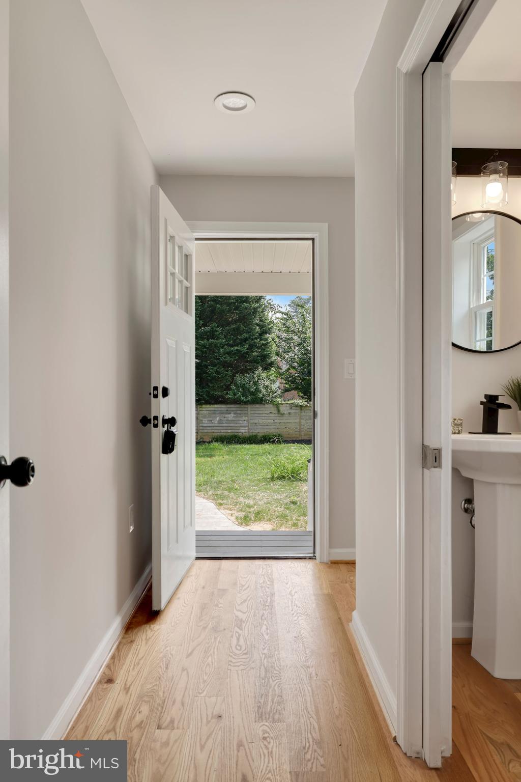 8112 Old Georgetown Road Bethesda, MD 20814 - Photo 18 of 51 a view of hallway with a large window and wooden floor