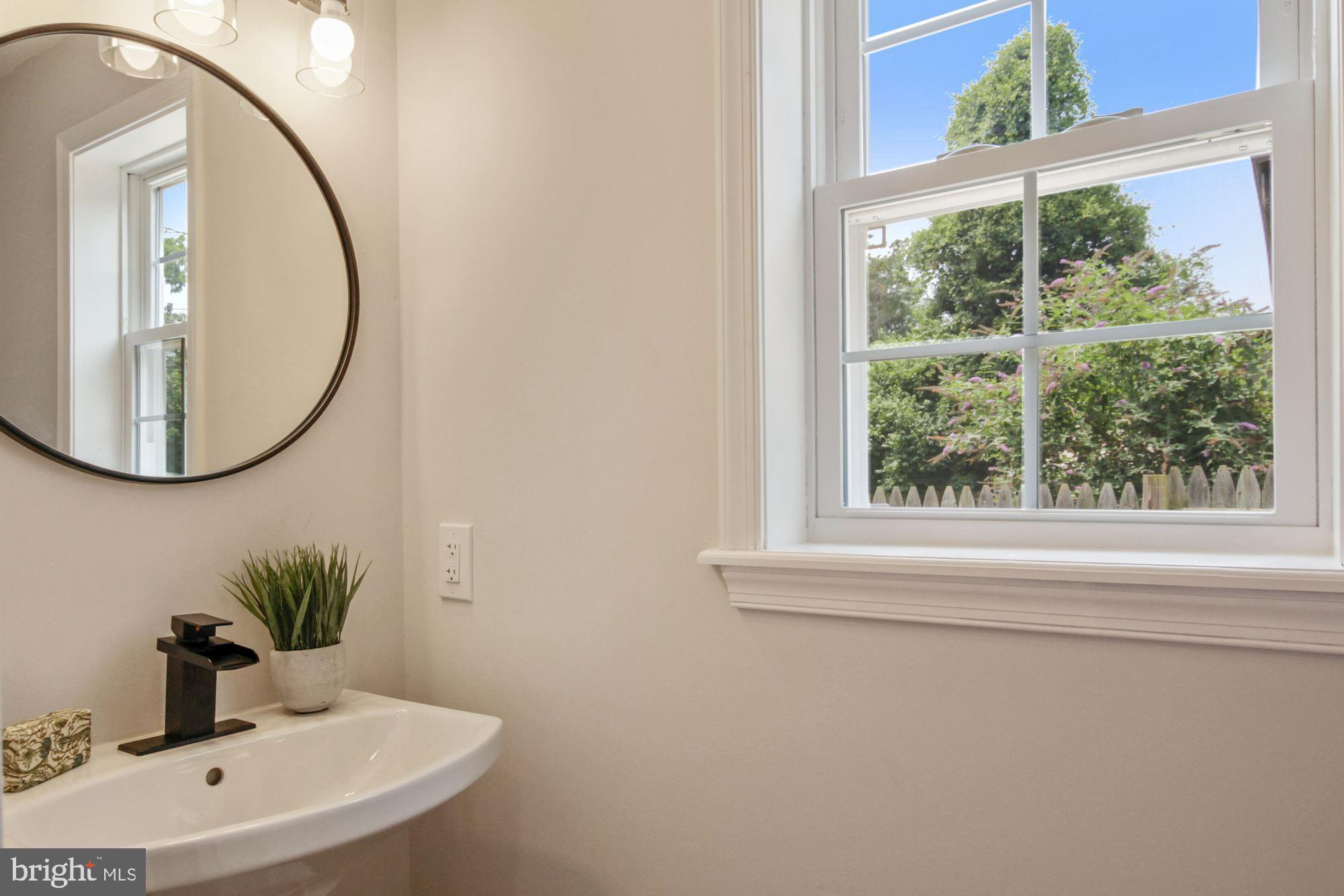 8112 Old Georgetown Road Bethesda, MD 20814 - Photo 20 of 51 a bathroom with a sink and a mirror
