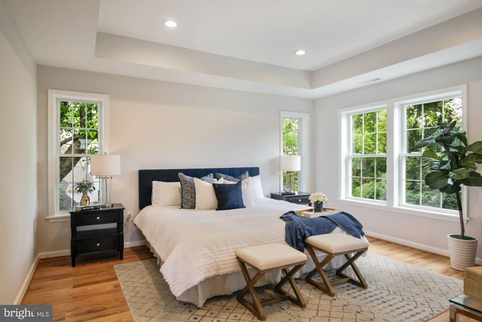 8112 Old Georgetown Road Bethesda, MD 20814 - Photo 21 of 51 a bed room with a bed and a chair
