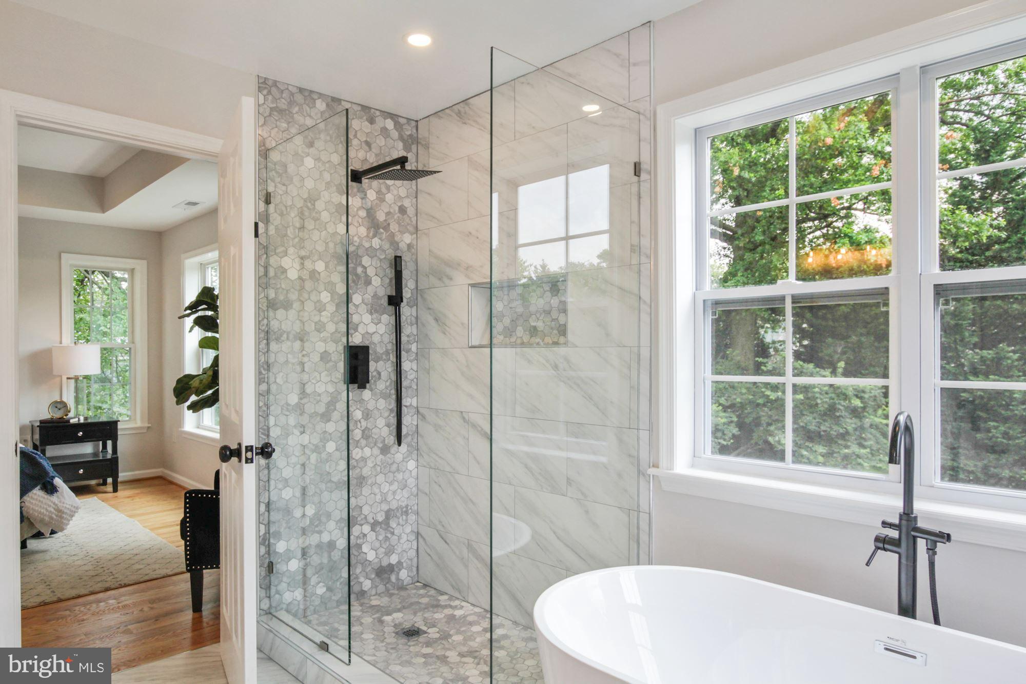 8112 Old Georgetown Road Bethesda, MD 20814 - Photo 25 of 51 a bathroom with a shower and a sink