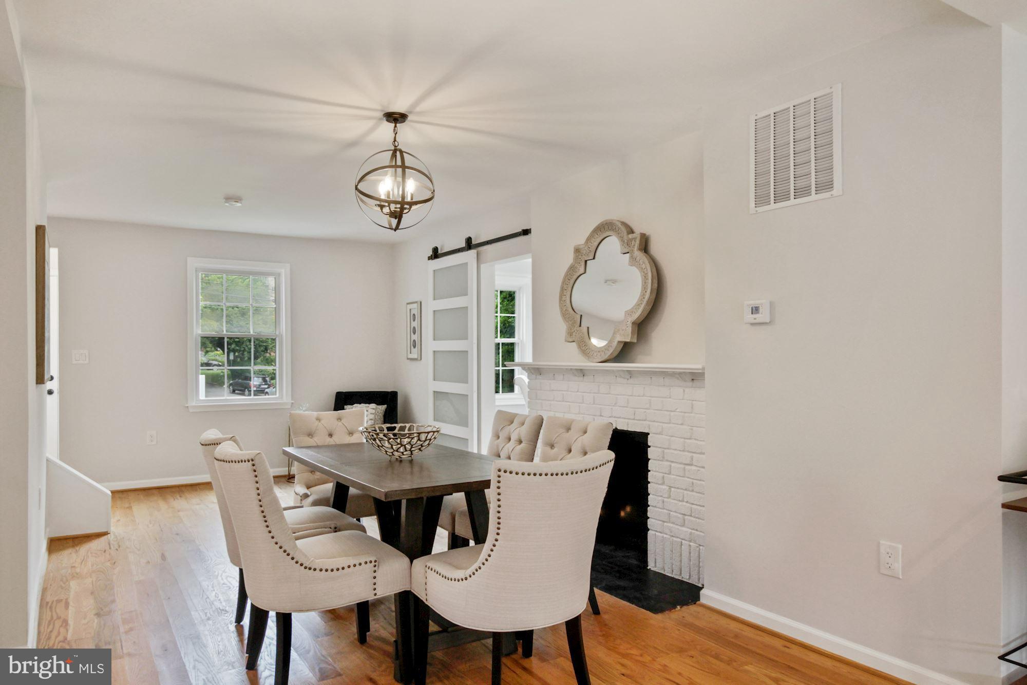 8112 Old Georgetown Road Bethesda, MD 20814 - Photo 5 of 51 a view of a dining room with furniture window and wooden floor