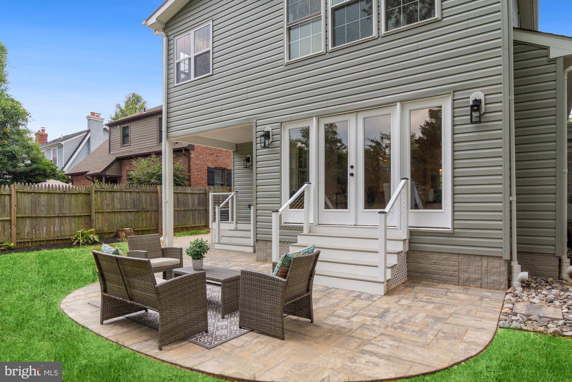 8112 Old Georgetown Road Bethesda, MD 20814 - Photo 45 of 51 a view of a house with backyard sitting area and garden