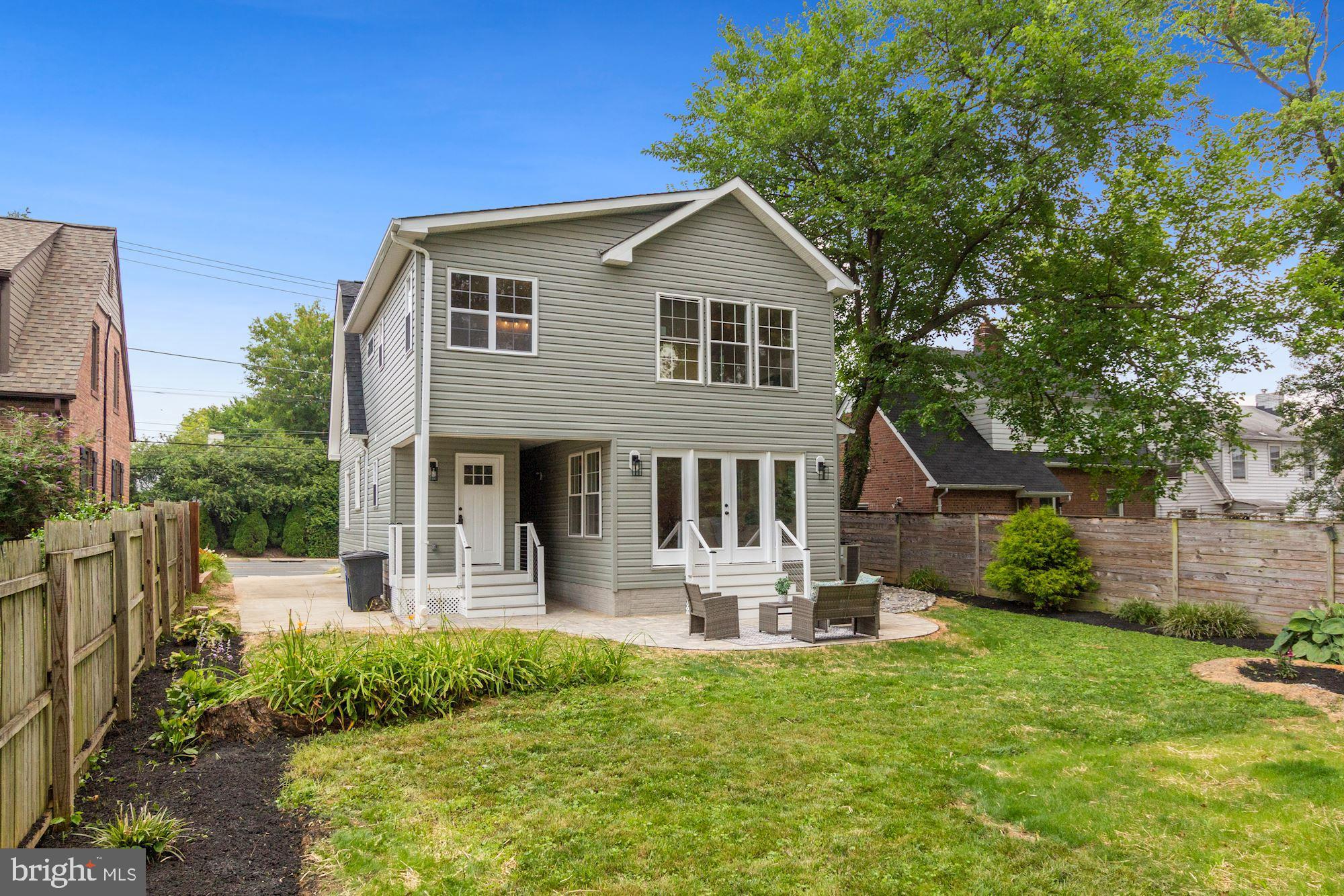 8112 Old Georgetown Road Bethesda, MD 20814 - Photo 46 of 51 a front view of a house with a yard