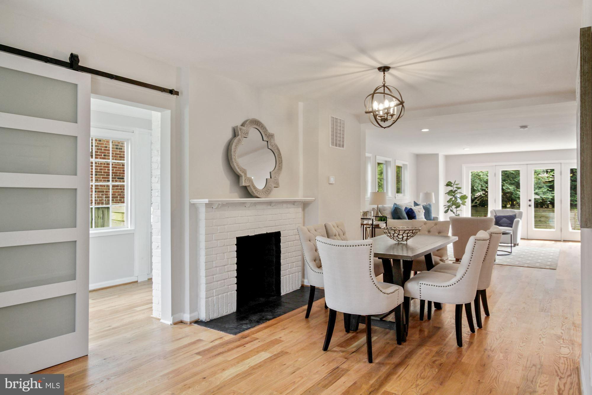 8112 Old Georgetown Road Bethesda, MD 20814 - Photo 6 of 51 a view of a dining room with furniture window and wooden floor