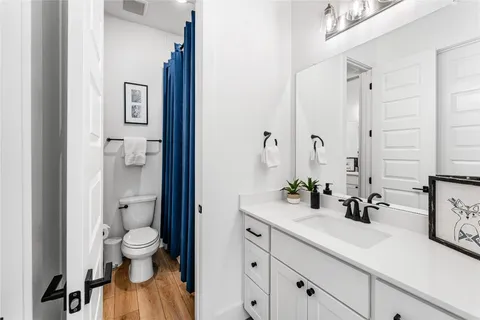 a living room with furniture large window and a table
